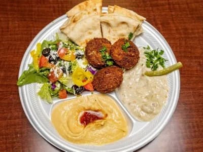 Vegetarian platter with falafel, baba ghanouj, salad and pita